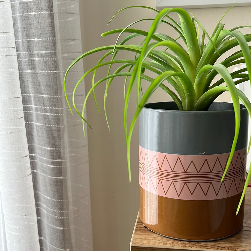 Vase with fake plant.